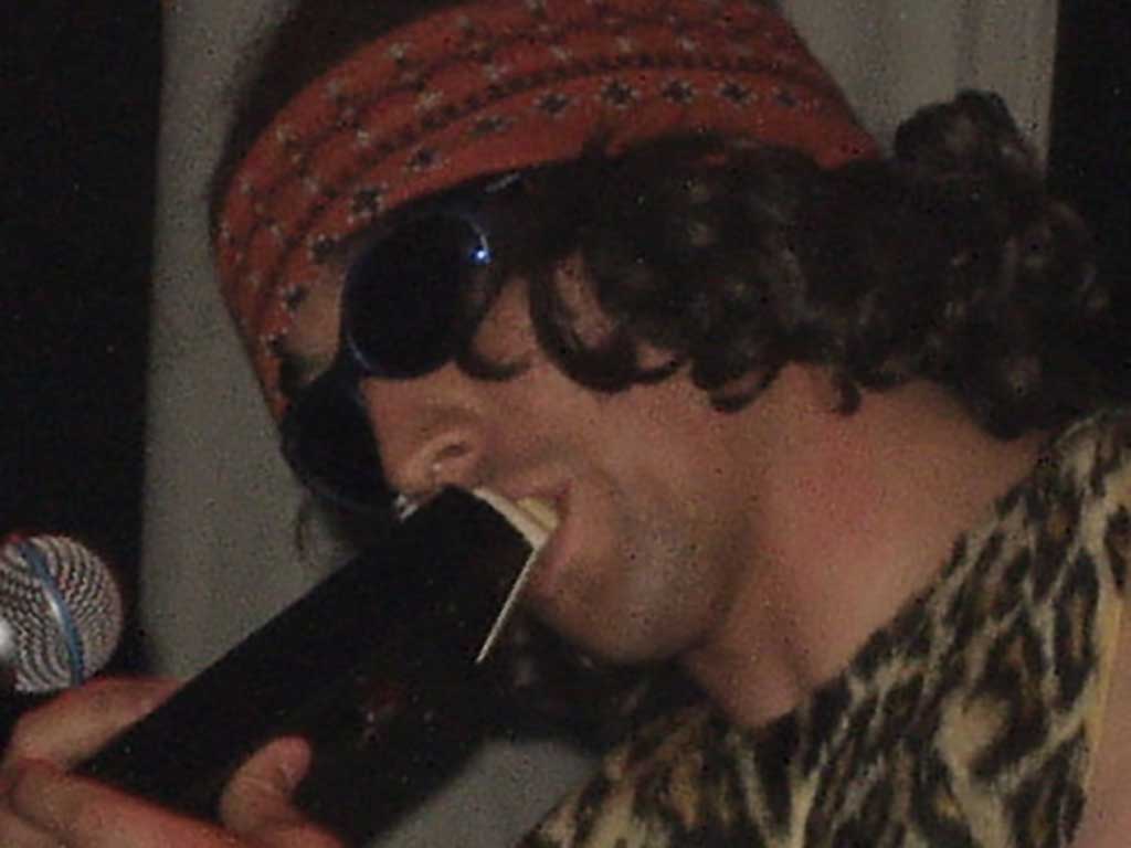 Kelburn Garden Party 2026 DJ Beastman blows into instrument