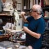 artist david cemmick in studio creating small sculpture