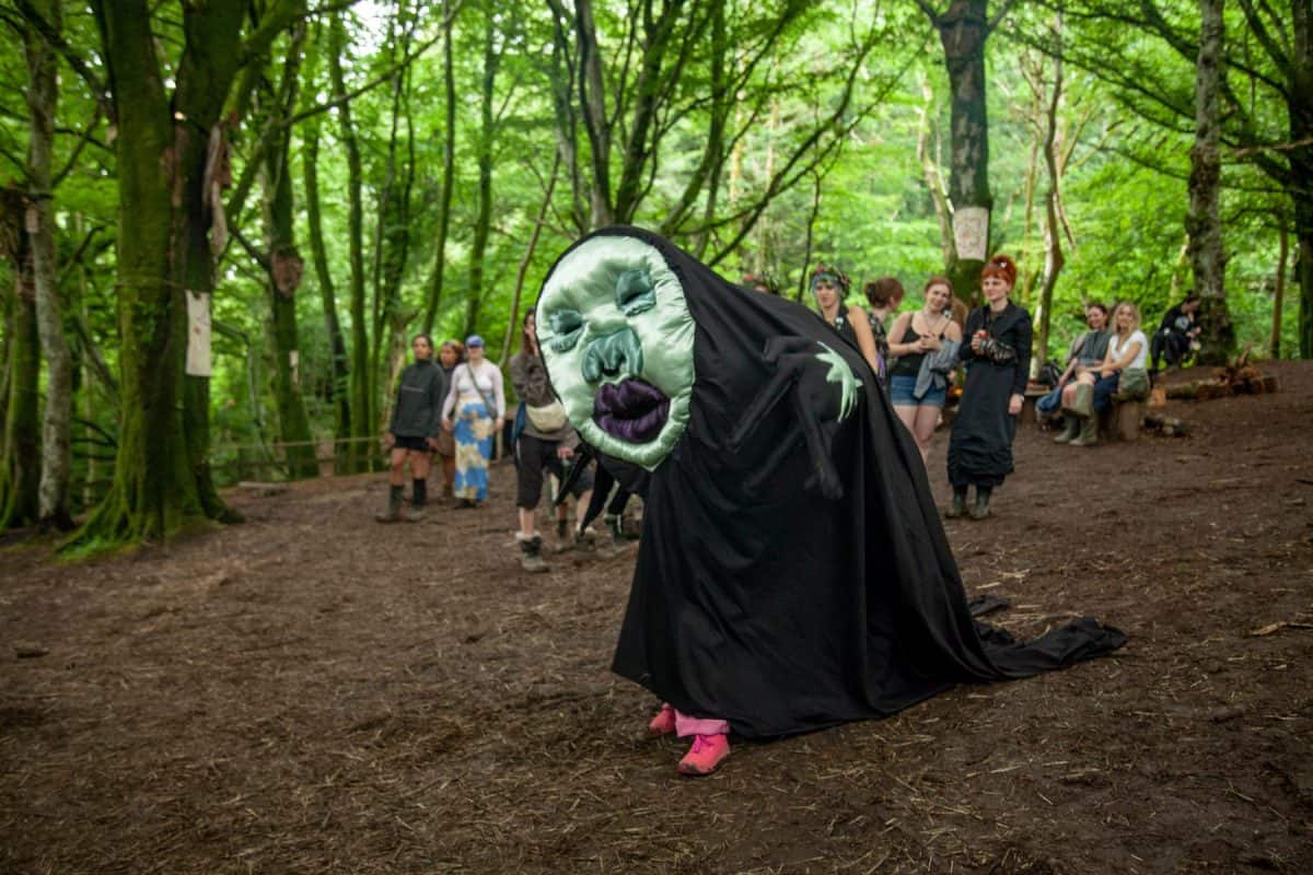 performer dressed in surreal costume for microsteria in neverending glen
